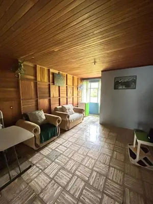 a living room with couches and a wooden ceiling at Finca Marbella in San Ramón