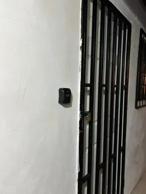 a door with a black door knob on a white wall at Perezoso View Apartment in Guápiles