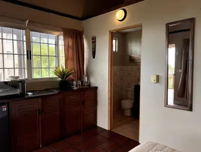 a bathroom with a sink and a toilet at Mi Zaru Sea View Hotel Free Park Tour & Breakfast in Manuel Antonio