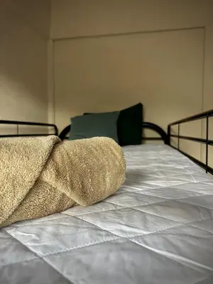 a bed with two pillows on top of it at House with a private swimming pool in Chontales