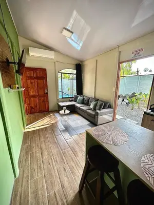 a living room with a couch and a table at House with a private swimming pool in Chontales