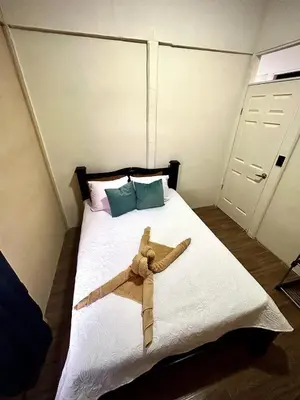 a teddy bear laying on top of a bed at House with a private swimming pool in Chontales