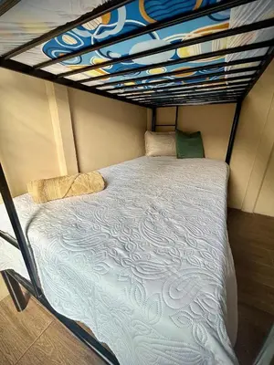 a bed in a small room with a bunk bed at House with a private swimming pool in Chontales