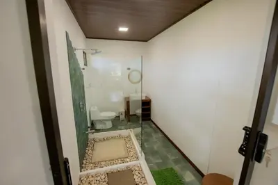a bathroom with a glass shower and a toilet at Casa del Lago in Repunta