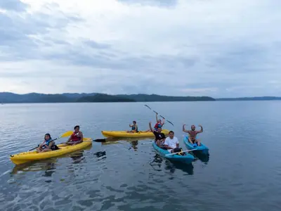 a group of people in kayaks on a lake at Casa Celeste Rio Grande #2 in Puntarenas