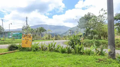 a sign on the side of a road at Rio Celeste Cabinas Vista Tenorio in El pilon