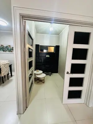 a room with a door leading to a room with a table at Venus Home in Guápiles
