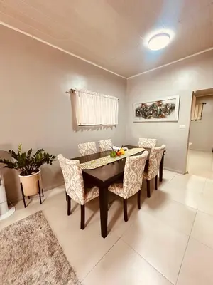 a dining room with a table and chairs at Venus Home in Guápiles