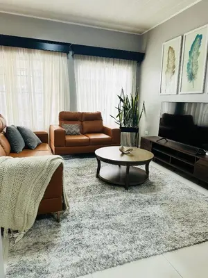 a living room with a couch and a coffee table at Venus Home in Guápiles