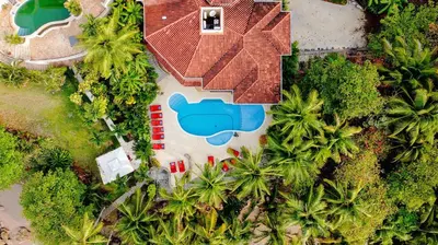 an aerial view of a resort with a swimming pool at Palacio Tropical- Secluded & Private Beach in Puntarenas