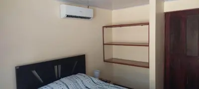 a bedroom with a bed and a book shelf at Capi-Capi Retreat in Paquera