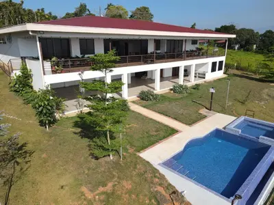 an aerial view of a house with a swimming pool at Home in Perez Zeledon with Chirripó Views in Angostura