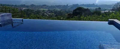 a swimming pool with a view of a mountain at Home in Perez Zeledon with Chirripó Views in Angostura