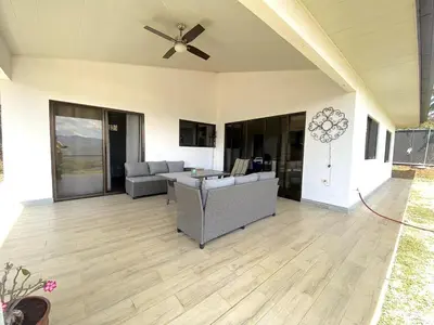 a living room with a couch and a ceiling fan at Casa Daniela, Relax and Enjoy! in Escobal