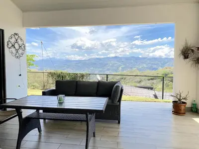 a living room with a couch and a table at Casa Daniela, Relax and Enjoy! in Escobal
