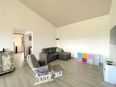 a living room with a couch and a chair and a table at Casa Daniela, Relax and Enjoy! in Escobal