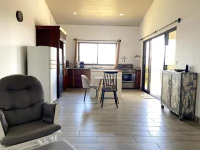 a kitchen with a table and chairs in a room at Casa Daniela, Relax and Enjoy! in Escobal
