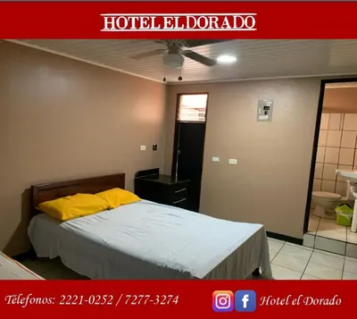 a hotel room with a bed and a bathroom at Hotel El Dorado in San José
