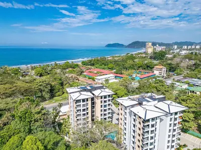 an aerial view of a city and the ocean at Torres del Mar oceanview 6th-floor two-bedroom condo in Jacó