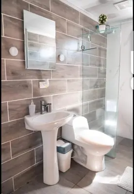 a bathroom with a white sink and a toilet at Fruta mango # 1 in Playa Guacalillo