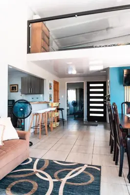 a living room with a couch and a table at Fruta mango # 1 in Playa Guacalillo
