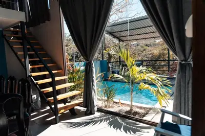 a view of a swimming pool from a house at Fruta mango # 1 in Playa Guacalillo