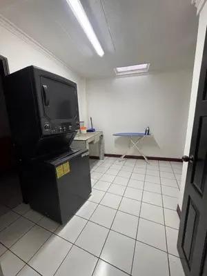 a living room with a tv and a tiled floor at Condomínio Vistas del Rio in San Antonio