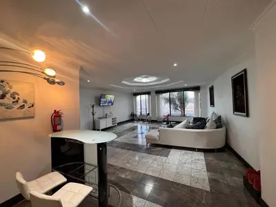 a living room with a couch and a table at Condomínio Vistas del Rio in San Antonio