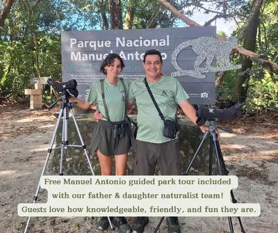 a man and woman standing in front of a camera at Zen Zaru Free MA Park Tour & Breakfast in Manuel Antonio