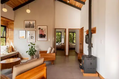 a living room with a wood burning stove at MAUMA Forest Villas - Fireplace & Amazing Views in Monteverde Costa Rica