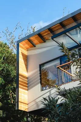 a house with a window on the side of it at MAUMA Forest Villas - Fireplace & Amazing Views in Monteverde Costa Rica
