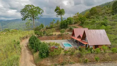an aerial view of a house on a hill at Bongalows Chepe Araya in Pejibaye