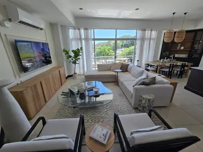 a living room with a couch and a table at Luxury Apartment by the Beach! in Santa Cruz