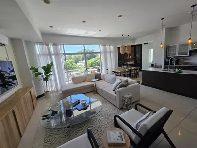 a living room with a couch and a table at Luxury Apartment by the Beach! in Santa Cruz