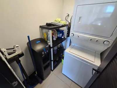 a kitchen with a refrigerator and a trash can at Luxury Apartment by the Beach! in Santa Cruz