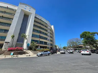 a large building with cars parked in front of it at Luxury Apartment by the Beach! in Santa Cruz