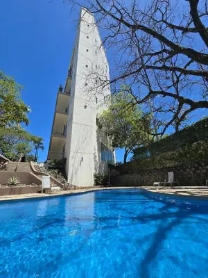 a swimming pool in front of a building at Luxury Apartment by the Beach! in Santa Cruz