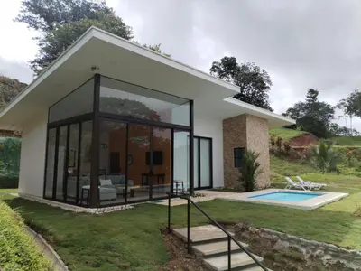 a small house with a pool in the yard at New House w Pool close to beach! in Esterillos Este