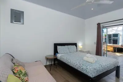 a bedroom with a bed and a couch at Casa Potrero in Potrero