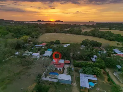 an aerial view of a house with the sunset in the background at Casa Potrero in Potrero