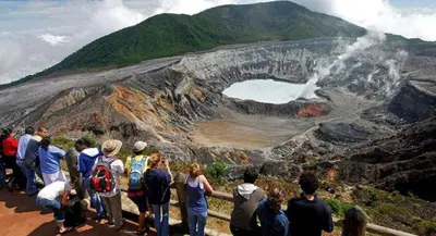 a group of people standing on top of a mountain at 2 Room 1 ba close to SJO airport, Poás and waterfalls in Alajuela City