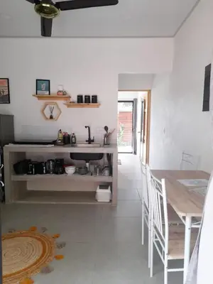 a kitchen with a table and a dining room at Moon Home Sand #2 in Playa hermosa