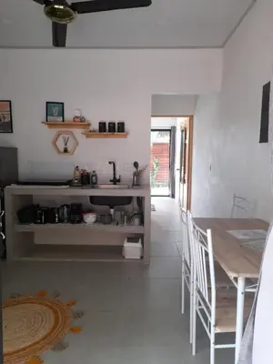 a kitchen with a table and a dining room at Moon Home Sand #2 in Playa hermosa