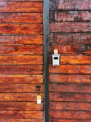 a wooden door with a box on it at Moon Home Sand #2 in Playa hermosa