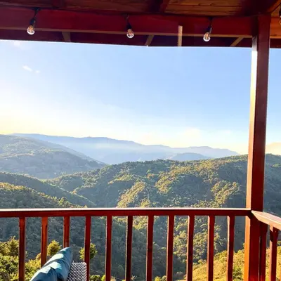 a view from the balcony of a mountain cabin at Cabaña Nora in Cedral