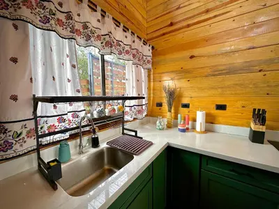 a kitchen with a sink and a window at Cabaña Nora in Cedral