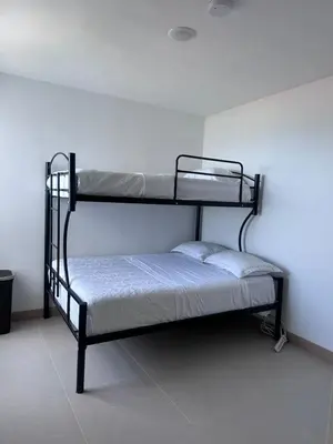 a bedroom with two bunk beds in a room at 16th Floor Oceanview Bliss in Jacó