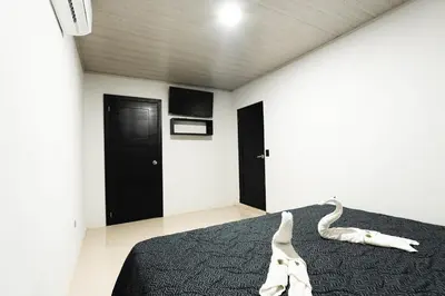 a bedroom with a bed with a snake on it at La Granja Boutique Nature Luxury and Relaxation in Guayabal