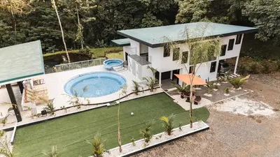 an aerial view of a house with a swimming pool at La Granja Boutique Nature Luxury and Relaxation in Guayabal