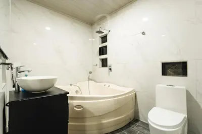 a bathroom with a sink and a tub and a toilet at La Granja Boutique Nature Luxury and Relaxation in Guayabal